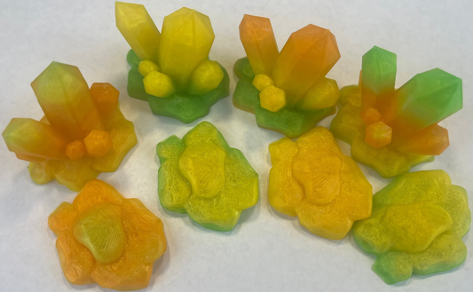 Colorful flower-shaped candies on a white background
