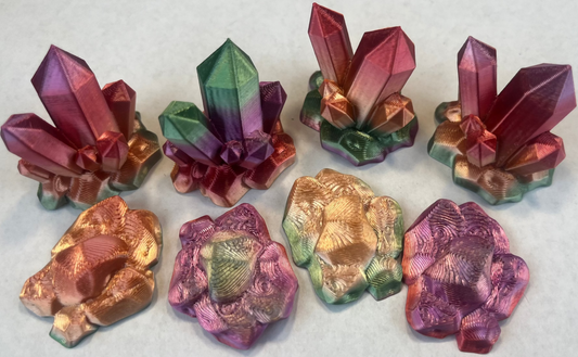 Colorful crystal-like sculptures on a white background