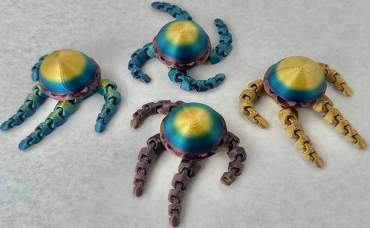 A set of magnetic jellyfish accessories with metallic finish and multicolored tentacles.
