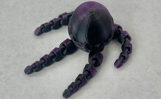A purple magnetic jellyfish-shaped accessory for a hat