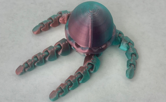A multicolored magnetic jellyfish-shaped accessory for a hat's brim